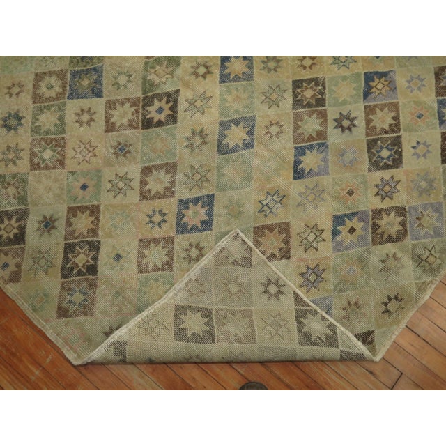 Intermediate size one of a kind midcentury Turkish Deco rug with earth accents in khaki, denim blue, and brown, circa...