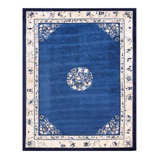 Fascinating Royal Blue Open Field With Floral Border in a Qing Style Antique Chinese Peking Rug For Sale
