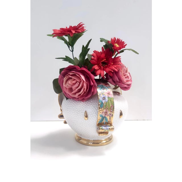 Made in Italy, 1950s. It is made in hand-modeled, glazed, golden and decorated earthenware. It may show slight traces of...