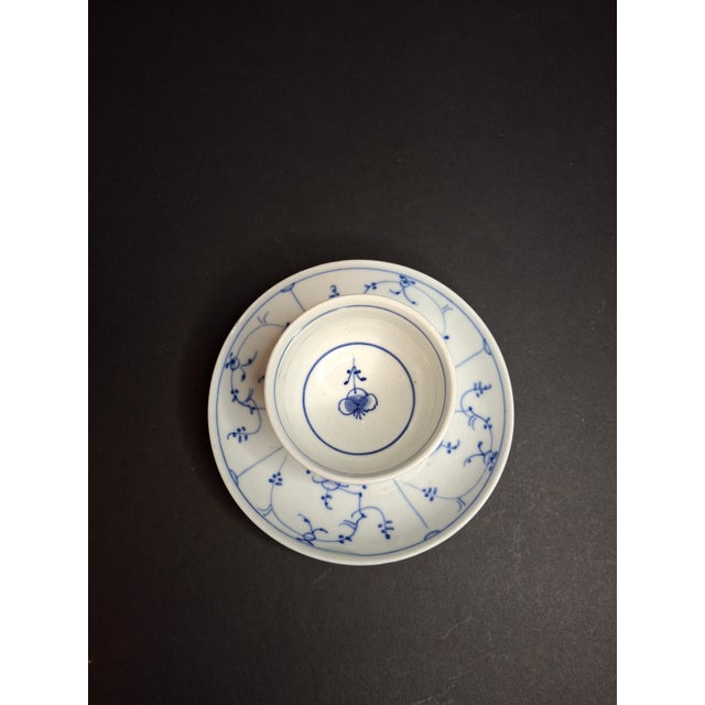 An exceptional antique Royal Copenhagen hand-painted porcelain handleless tea bowl (teacup) and deep saucer set in the...