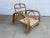 Restored original 1948 Paul Laszlo-designed two-strand "Staple Arm" lounge chair finished with a dark chestnut stain. The...
