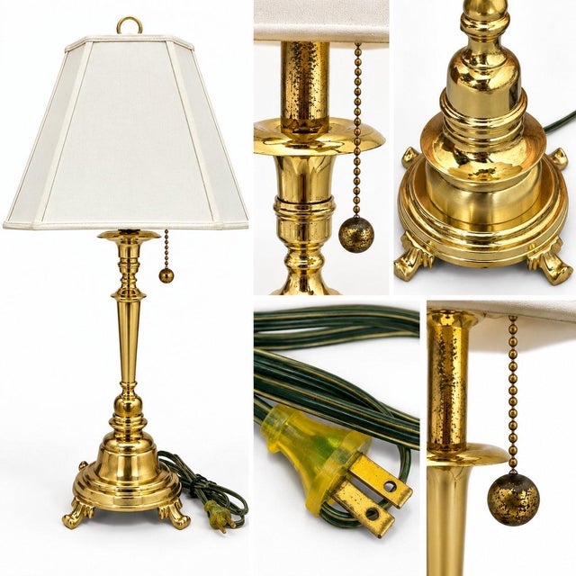 This is a traditional brass table lamp with a Neoclassical / Hollywood Regency style influence. Overall, the lamp fits...