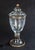 A timeless expression of Italian artistry, this elegant crystal urn features intricate hand-etched floral and geometric...