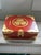 An antique asian red lacquered box accented in gold.
