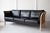 An elegant, black leather three-seater sofa, manufactured by Mogens Hansen, Stouby with a pleasing beech frame and quality...