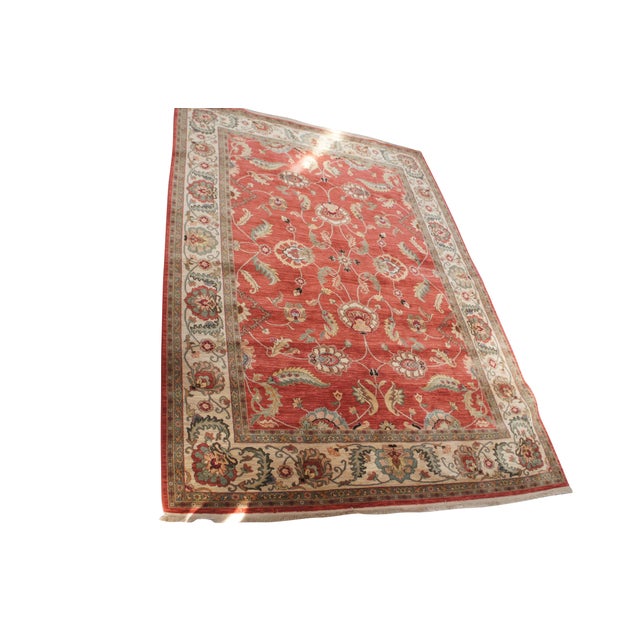 Vintage Karastan 100% wool area rug / mat / carpet featuring a floral motif inspired by palmettes and scrolled vines on a...