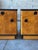 A pair of Art Deco period nightstands. Burlwood and black laquer. Large, hearty knobs are a great detail. Large drawer and...