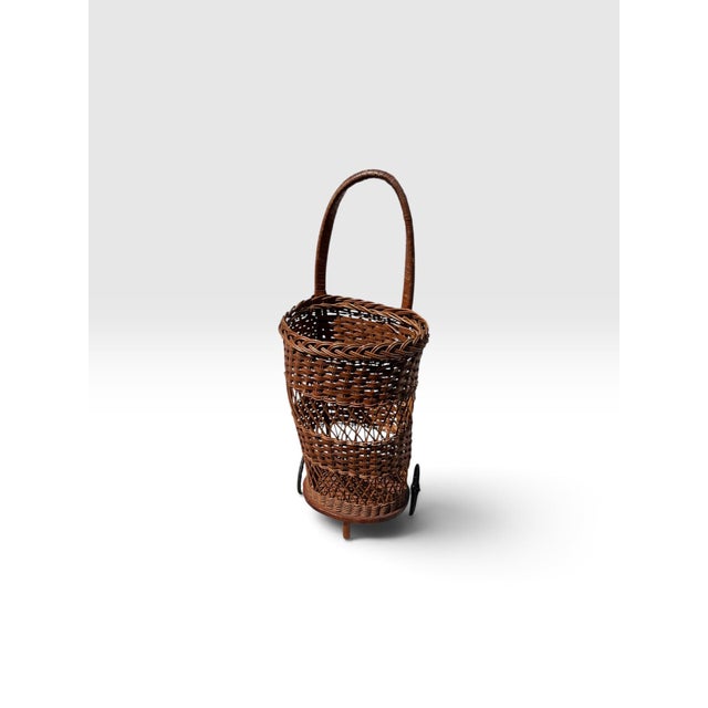 Charming early 20th-century handwoven wicker market basket or shopping trolley featuring exceptional traditional basketry...