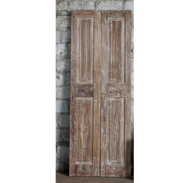 Bring authentic farmhouse warmth to your home with this stunning antique carved double barn door, handcrafted from solid...