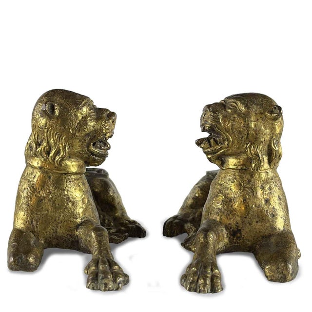 A pair of gilded bronze lions, Nuremberg, circa 1500, probably originally used as the legs of a coin cabinet or cabinet...