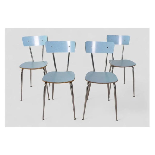 These four chairs with their simple, vibrant design are a true throwback to 1960s domestic style. The chrome tubular metal...