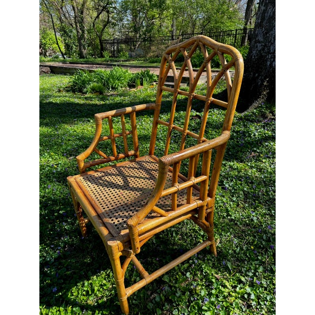 Beautiful rattan cathedral side chair in the style of McGuire. A great side chair in a bedroom or living room.