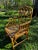 Beautiful rattan cathedral side chair in the style of McGuire. A great side chair in a bedroom or living room.