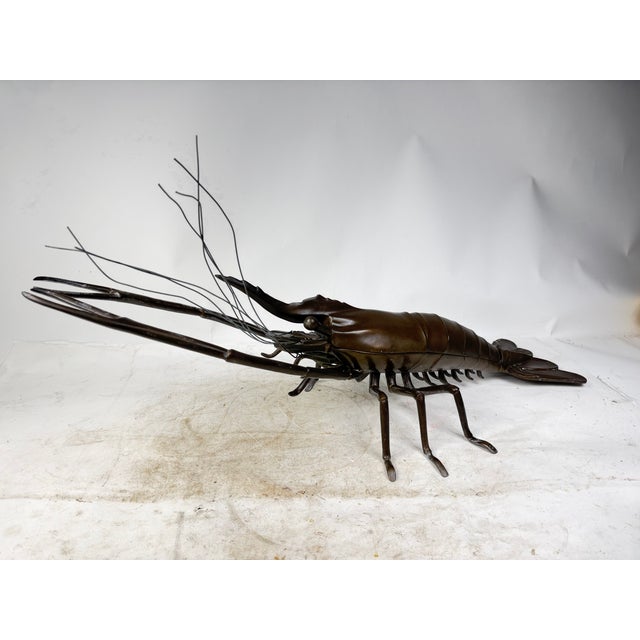 Beautiful and majestic bronze sculpture of an articulated lobster in Okimono style. The lobster opens and serves as a...
