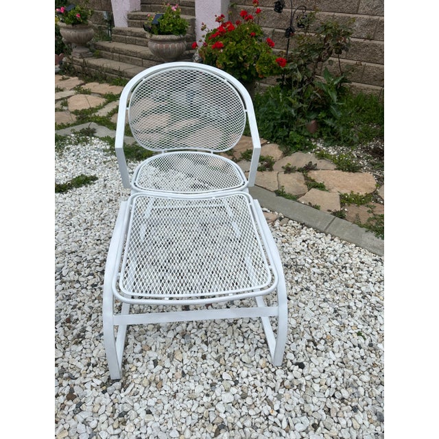 A rare set of a rocking chair and ottoman by Russell Woodard Newly spray painted white No breaks or structural damage....