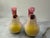 A cheerful pair of vintage figural salt and pepper shakers from 1950s Japan, modeled as plump little songbirds with...