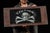 Striking ROG Odd Fellows lodge sign featuring the word “CAUTION” arched above a skull-and-crossbones motif. Executed in...