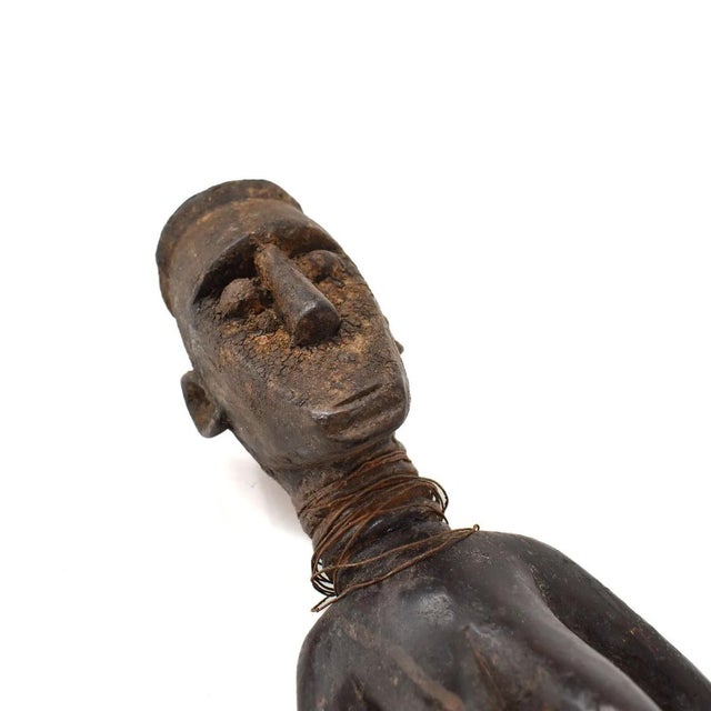 The Toma wood figure, hand-carved in West Africa, exemplifies the artistic skill of the Toma people. This sculpture,...