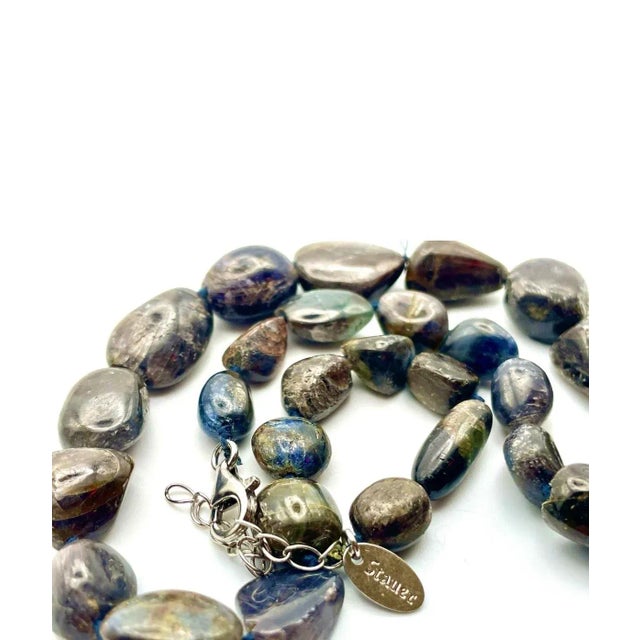 Raw Sapphire Necklace is a well-made necklace with a raw sapphire stone. The stones shimmer with shades of violet, blue...