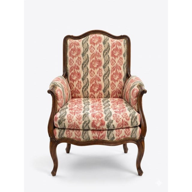 French Louis XV–Style Walnut Bergère Armchairs in Ikat Upholstery With Brass Nail Head Trim — 20th Century Matching Pair For Sale - Image 3 of 9