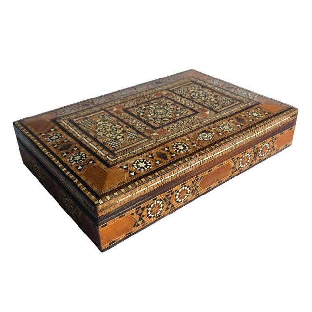 Offered is a vintage Damascene Syrian mosaic marquetry jewelry/trinket box. It features an intricate Middle Eastern inlaid...