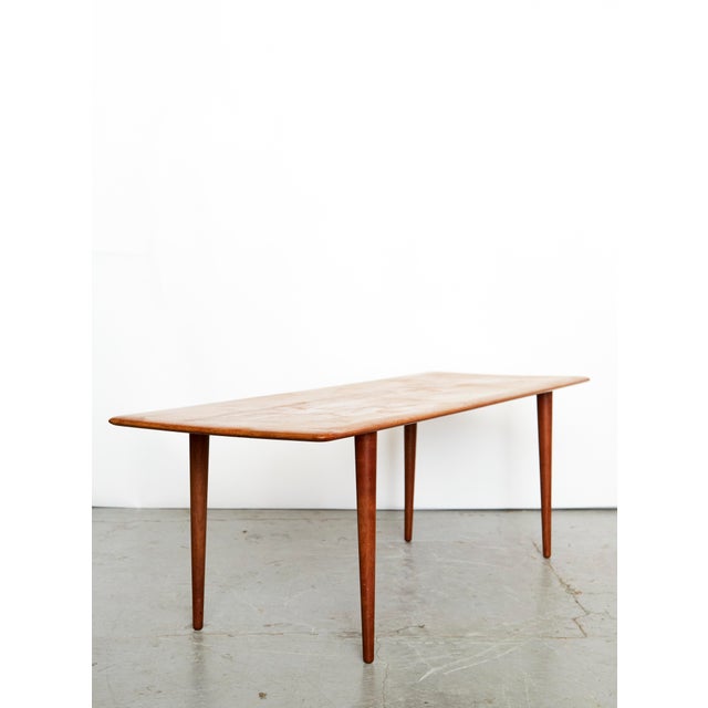 Condition: Minor signs of wear on the tabletop. Made of solid teak. Labeled on the underside. This piece has an...