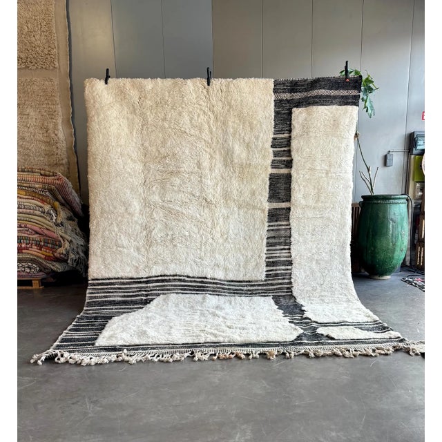 Discover the warmth and charm black and whitel Moroccan Rug, a perfect blend of tradition and style. This Authentic...