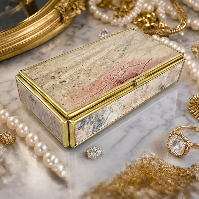 Offering a stunning small jewelry or keepsake box made out of a semi-precious stone called Rhyolite. The box was made in...