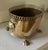 Vintage brass oval Jardinière with lion head handles, paw feet and filigree trim. The stamp on the bottom is "hand forged"...