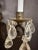Pair of Gothic/Renaissance form wrought iron and gilt tole frame wall sconces dressed with rock crystal pendants. Rock...