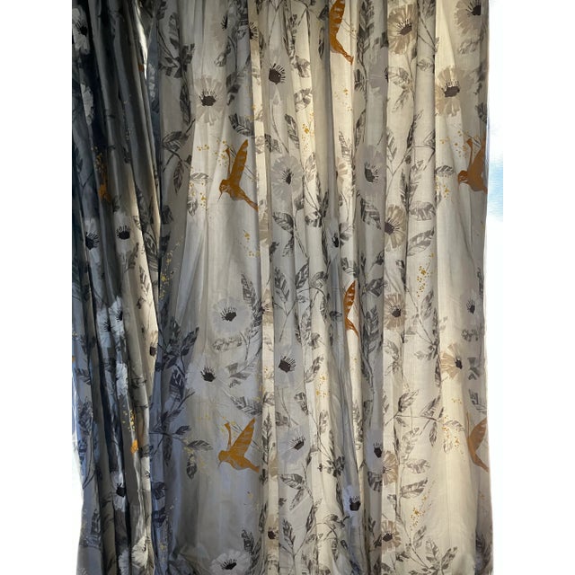 Beautiful silk fabric, silver background with white and black flowers with black leaves. Yellow flower buds and yellow...