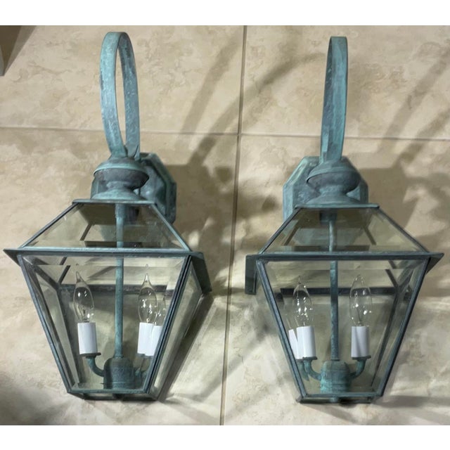 pair of vintage solid brass lanterns exudes timeless elegance and old-world charm. Crafted from , high-quality solid...