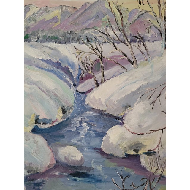 This lovely plein air painting features a stream surrounded by snow and mountains in the background. This is an original...