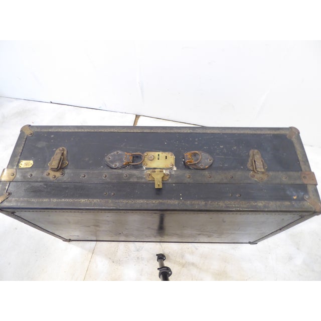 This French leather trunk has an old label that identifies the locks used as "Fermiture Fichet Lock, Paris".