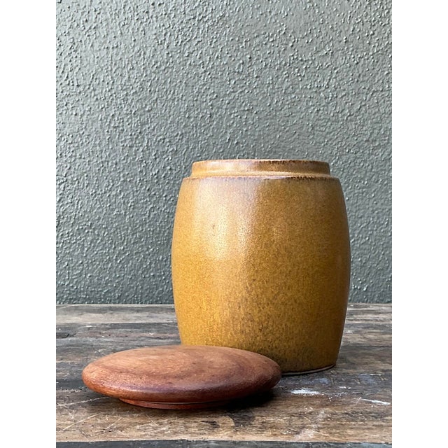 This sophisticated vintage lidded jar by the iconic luxury brand Alfred Dunhill is a superb example of Mid-Century Modern...