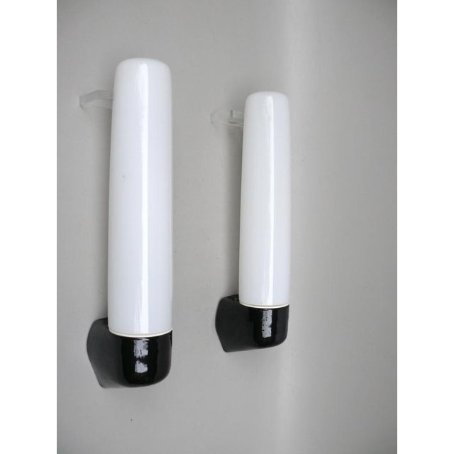 A pair of rare, minimalist mirror lamps designed by wilhelm wagenfeld for lindner gmbh, bamberg. The design dates from...