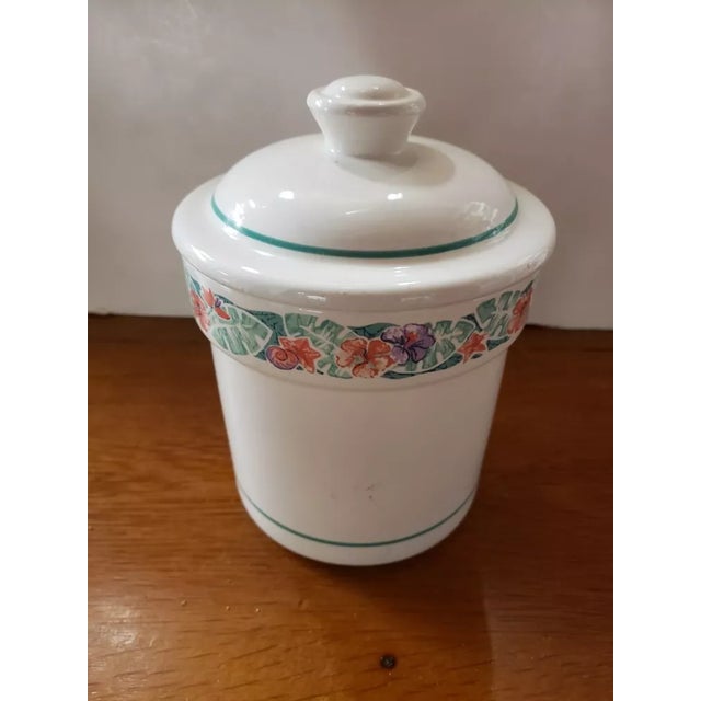 This is a 1970's Treasure Craft Tropics Ceramic Cookie Jar, Made in USA. It measures 7 3/4" high to top of lid and 6“ in...