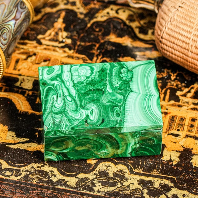 This exquisite rectangle shaped malachite box is a true statement of luxury and elegance, showcasing the vibrant green...
