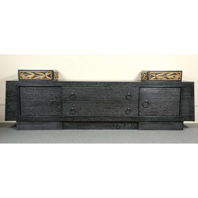 Stunning cabinet by James Mont The oak cabinet is finished in a cerused blue / black and the small pedestals at each end...