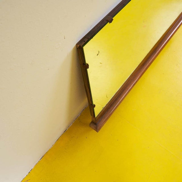 This charming wooden mirror is a perfect example of vintage design. Featuring a simple natural wood frame, it adds a touch...