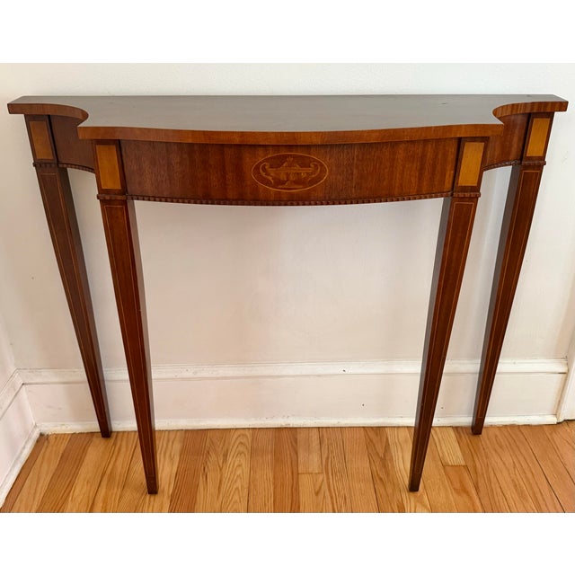 1990s Federal style inlaid mahogany console table on tall tapering legs. An 18th century design with quality construction...
