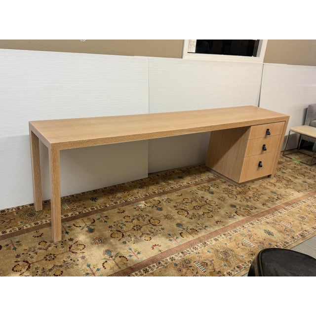 Design Plus Gallery presents a Long Line Desk with Drawers of Lime Washed Oak Wood. The desk has a tremendous texture as...