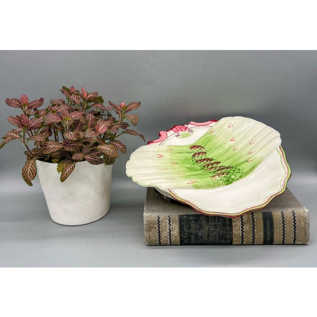 Stunning asparagus dish made by Abigails in the early 21st century. This discontinued piece is a modern reproduction of an...