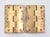 Vintage cabinet door hinges made of polished brass with flat tips, five knuckles, and a template hole pattern. The...