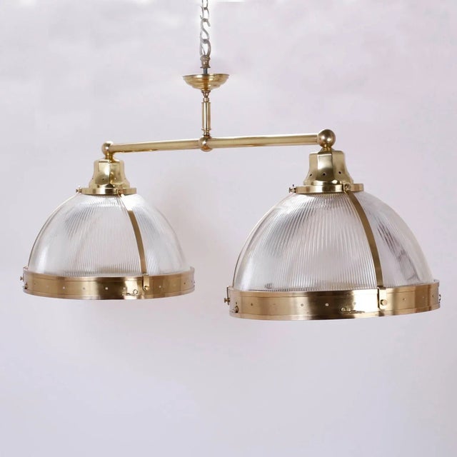 Chic double dome chandelier or pendant light fixture that is both elegant and industrial. The dome glass is ribbed for a...