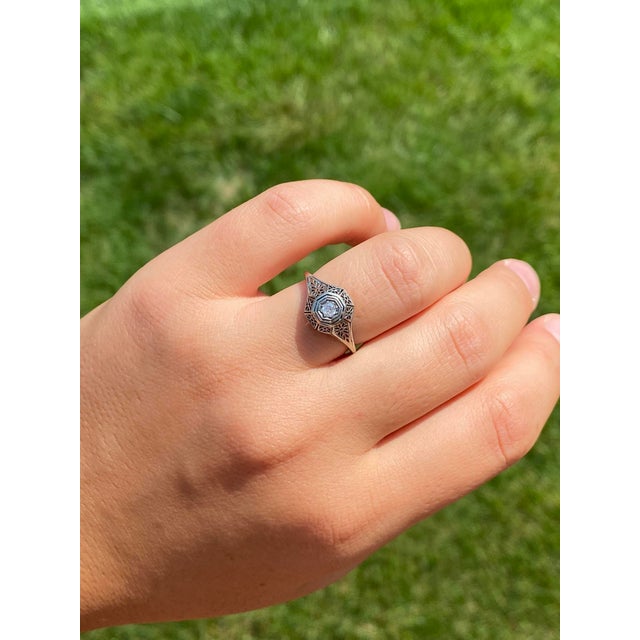 The Davis Drive: Art Deco Engagement Ring in White Gold. The ring centers on a 0.10 carat Old Mine cut natural diamond in...