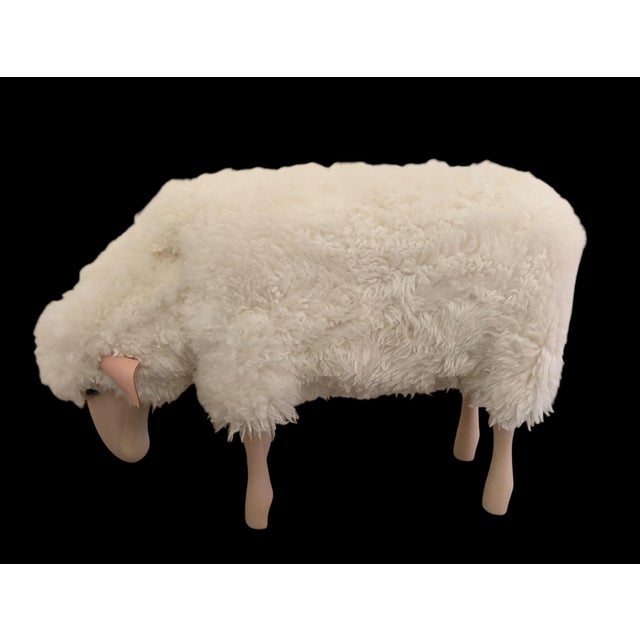 Equal parts iconic and adorable, this life-size Lalanne-style grazing sheep is made of wood, with leather ears and...