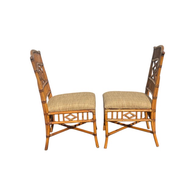 A pair. Late 20th century natural color bamboo side chairs. Each measure 39” x 19” x 23”d. Seats (newly recovered) 19” off...