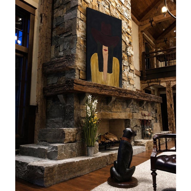 “Burgundy Brim” is a striking original oil on canvas by Marek, depicting an enigmatic woman whose face is partially...