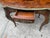 This antique French walnut and marquetry ladies writing desk from the 19th century exudes elegance and sophistication....